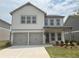 Charming two-story home featuring a two-car garage and neatly manicured lawn at 2093 Boxwood Se Cir, Conyers, GA 30094