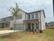 Charming two-story home featuring a two-car garage and well-maintained lawn at 2093 Boxwood Se Cir, Conyers, GA 30094