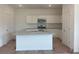 Bright kitchen with granite countertops, stainless steel appliances, and a central island at 2093 Boxwood Se Cir, Conyers, GA 30094