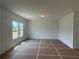 Bright, spacious living area with recessed lighting and large windows overlooking the yard at 2093 Boxwood Se Cir, Conyers, GA 30094