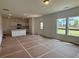 Spacious living room area with recessed lighting and a partial view of the kitchen at 2093 Boxwood Se Cir, Conyers, GA 30094
