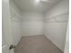 A large walk-in closet provides ample storage, featuring shelving and a spacious layout at 2093 Boxwood Se Cir, Conyers, GA 30094