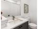 Bathroom featuring gray vanity, white countertop, and framed botanical print at 1265 Wright Se Ln, Atlanta, GA 30316