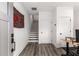 Bright foyer with hardwood floors, stairs, and neutral walls showcasing a welcoming modern aesthetic at 1265 Wright Se Ln, Atlanta, GA 30316