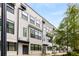 Exterior view of modern townhome featuring black framed windows and awnings at 1265 Wright Se Ln, Atlanta, GA 30316