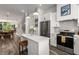 Modern kitchen with stainless steel appliances, island with seating, and stylish pendant lighting at 1265 Wright Se Ln, Atlanta, GA 30316
