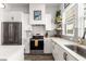 Bright kitchen featuring white cabinetry, stainless steel appliances, and natural light from the window at 1265 Wright Se Ln, Atlanta, GA 30316