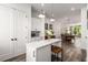 Open-concept kitchen with a center island, stainless steel appliances, and modern pendant lighting at 1265 Wright Se Ln, Atlanta, GA 30316