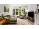 Cozy living room with a large window, comfortable seating, and stylish decor at 1265 Wright Se Ln, Atlanta, GA 30316