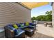 Outdoor rooftop deck area with comfortable seating, greenery, and string lights at 1265 Wright Se Ln, Atlanta, GA 30316
