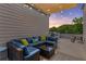 Cozy rooftop deck with lounge seating, string lights, and beautiful sunset views at 1265 Wright Se Ln, Atlanta, GA 30316