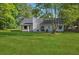 View of the rear exterior highlighting the backyard and the home's architectural details at 161 Brookfield Dr, Stockbridge, GA 30281