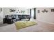 Expansive basement featuring a large sectional sofa and soft carpet at 161 Brookfield Dr, Stockbridge, GA 30281