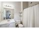 Bathroom with a white vanity, framed mirror and a shower with white shower curtain at 161 Brookfield Dr, Stockbridge, GA 30281