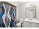 Clean bathroom featuring modern fixtures, a stylish shower curtain, and ample lighting for a fresh feel at 161 Brookfield Dr, Stockbridge, GA 30281