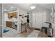 Inviting entryway with stylish decor, chair, and a view into the kitchen featuring modern appliances at 161 Brookfield Dr, Stockbridge, GA 30281