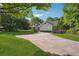 A beautiful shot of the home showcasing its mature tree landscaping and well-maintained surroundings at 161 Brookfield Dr, Stockbridge, GA 30281
