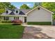 Charming one story home featuring a well-manicured lawn and inviting curb appeal at 161 Brookfield Dr, Stockbridge, GA 30281