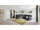Comfortable living area featuring a large sectional, plush rug, and ample natural light at 161 Brookfield Dr, Stockbridge, GA 30281