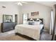 Bright main bedroom featuring a ceiling fan, large windows, and a neutral color palette at 161 Brookfield Dr, Stockbridge, GA 30281