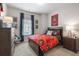 Bedroom featuring a bed with Atlanta United decor, neutral walls, and window at 210 Bastian Dr # 109, Villa Rica, GA 30180