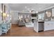 Open-concept living space with hardwood floors, modern decor, and abundant natural light at 210 Bastian Dr # 109, Villa Rica, GA 30180
