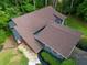 An overhead view of the home's brown roof and a manicured lawn at 2674 Skylane Dr, Marietta, GA 30062