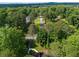 Aerial view of the home in a wooded area, located on a street with other homes at 2674 Skylane Dr, Marietta, GA 30062