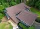 Birds-eye-view of the house with a brown roof, green lawn, and beautiful landscaping at 2674 Skylane Dr, Marietta, GA 30062