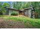 Backyard of home with a deck and abundant trees offering privacy at 2674 Skylane Dr, Marietta, GA 30062