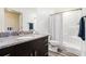 Clean bathroom featuring a dark vanity with a granite countertop, toilet, and a shower with curtain at 2674 Skylane Dr, Marietta, GA 30062
