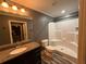 Bathroom with granite countertops, updated fixtures, and a shower at 2674 Skylane Dr, Marietta, GA 30062
