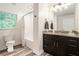Bathroom with dark wood vanity, granite counters, and tub/shower combination at 2674 Skylane Dr, Marietta, GA 30062