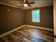 Bedroom with hardwood floors, a ceiling fan, and natural light from the window at 2674 Skylane Dr, Marietta, GA 30062