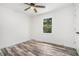 Bright bedroom with plank flooring, a ceiling fan, and white trim and a view to the yard at 2674 Skylane Dr, Marietta, GA 30062