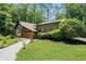 A charming home exterior featuring lush landscaping and inviting walkway at 2674 Skylane Dr, Marietta, GA 30062