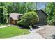 Home exterior featuring sloped yard, a driveway and garage parking at 2674 Skylane Dr, Marietta, GA 30062