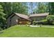 Exterior of a home with a charming back, wood and stucco materials at 2674 Skylane Dr, Marietta, GA 30062