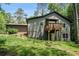 Exterior view of home, showcasing the siding, private balcony, and landscaped backyard at 2674 Skylane Dr, Marietta, GA 30062