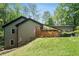 Charming exterior with wooded back, sloped yard and beautiful landscaping at 2674 Skylane Dr, Marietta, GA 30062