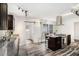 Modern kitchen featuring stainless steel appliances, a kitchen island, and a sliding barn door for a rustic touch at 2674 Skylane Dr, Marietta, GA 30062