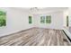Sunlit living room with hardwood floors and large windows showcasing nature views at 2674 Skylane Dr, Marietta, GA 30062
