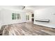 Open living room area with hardwood floors, modern wall feature, and natural light at 2674 Skylane Dr, Marietta, GA 30062