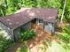 Aerial view showcases the home's brown roof, rear deck, and well-maintained surroundings at 2674 Skylane Dr, Marietta, GA 30062
