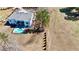 Aerial view of a modern house with a backyard pool, patio, and meticulous landscaping on a large lot at 292 Highway 279, Fayetteville, GA 30214