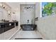 Elegant bathroom with a freestanding tub, dual sinks, and contemporary lighting at 292 Highway 279, Fayetteville, GA 30214