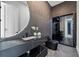 Modern bathroom with black marble vanity, sleek lighting and glass shower at 292 Highway 279, Fayetteville, GA 30214