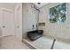 Modern bathroom features a luxurious black soaking tub, marble accents, and sleek fixtures at 292 Highway 279, Fayetteville, GA 30214