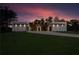 Modern home featuring professional landscaping and a long driveway at sunset at 292 Highway 279, Fayetteville, GA 30214