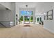 Modern foyer with high ceilings, sleek lighting, expansive windows, and stylish decor at 292 Highway 279, Fayetteville, GA 30214